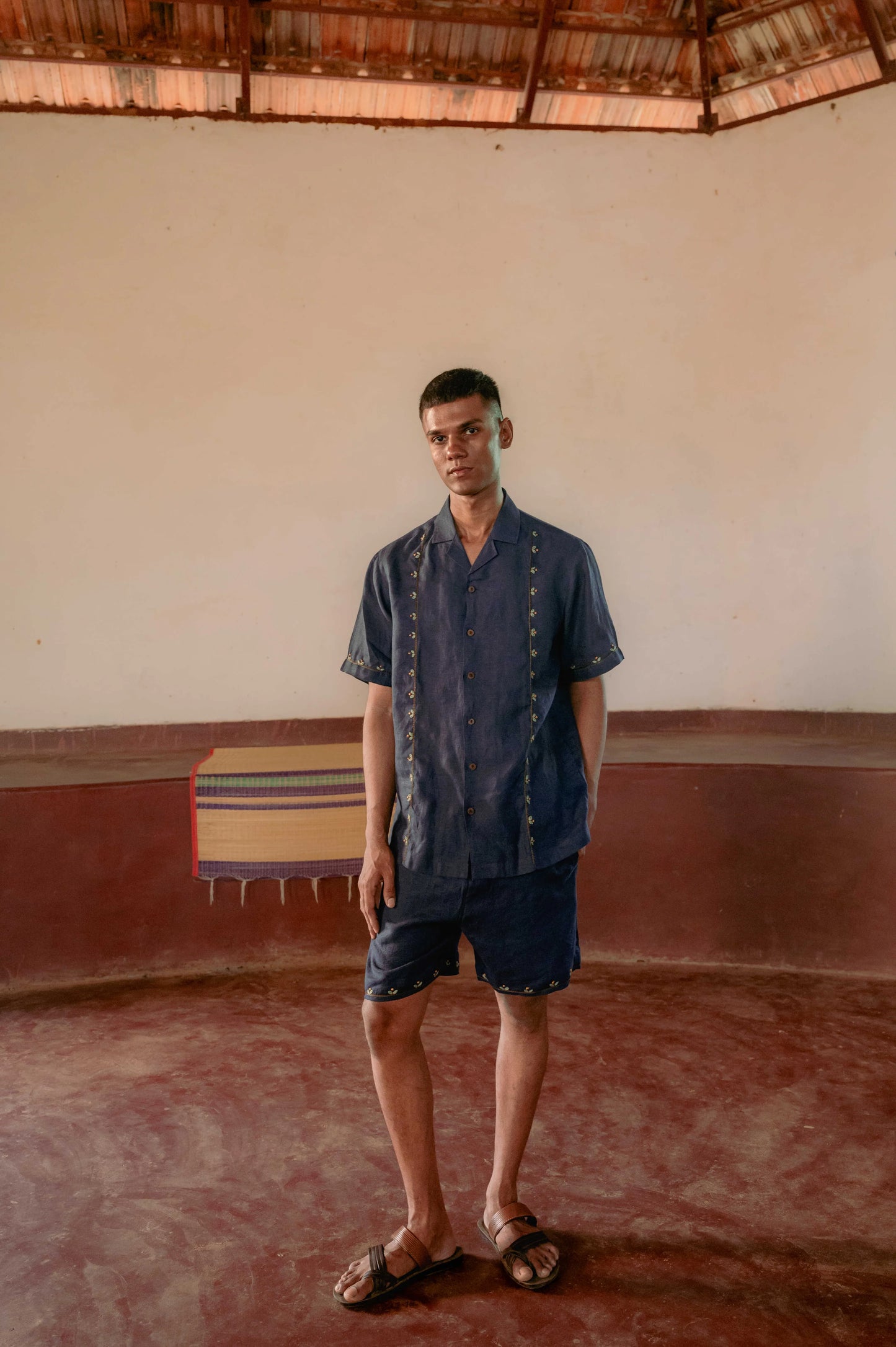 Buds in blue embroidered linen shorts