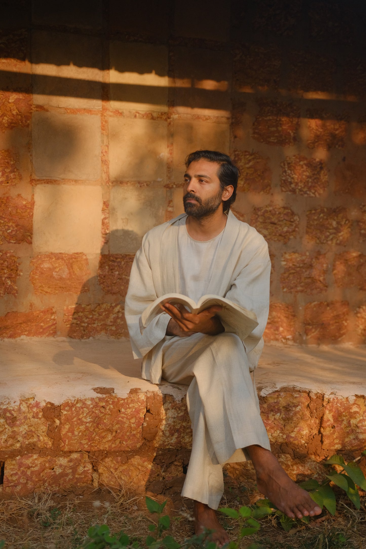 Harsh reading in an off-white Japanese Samue inspired linen overshirt