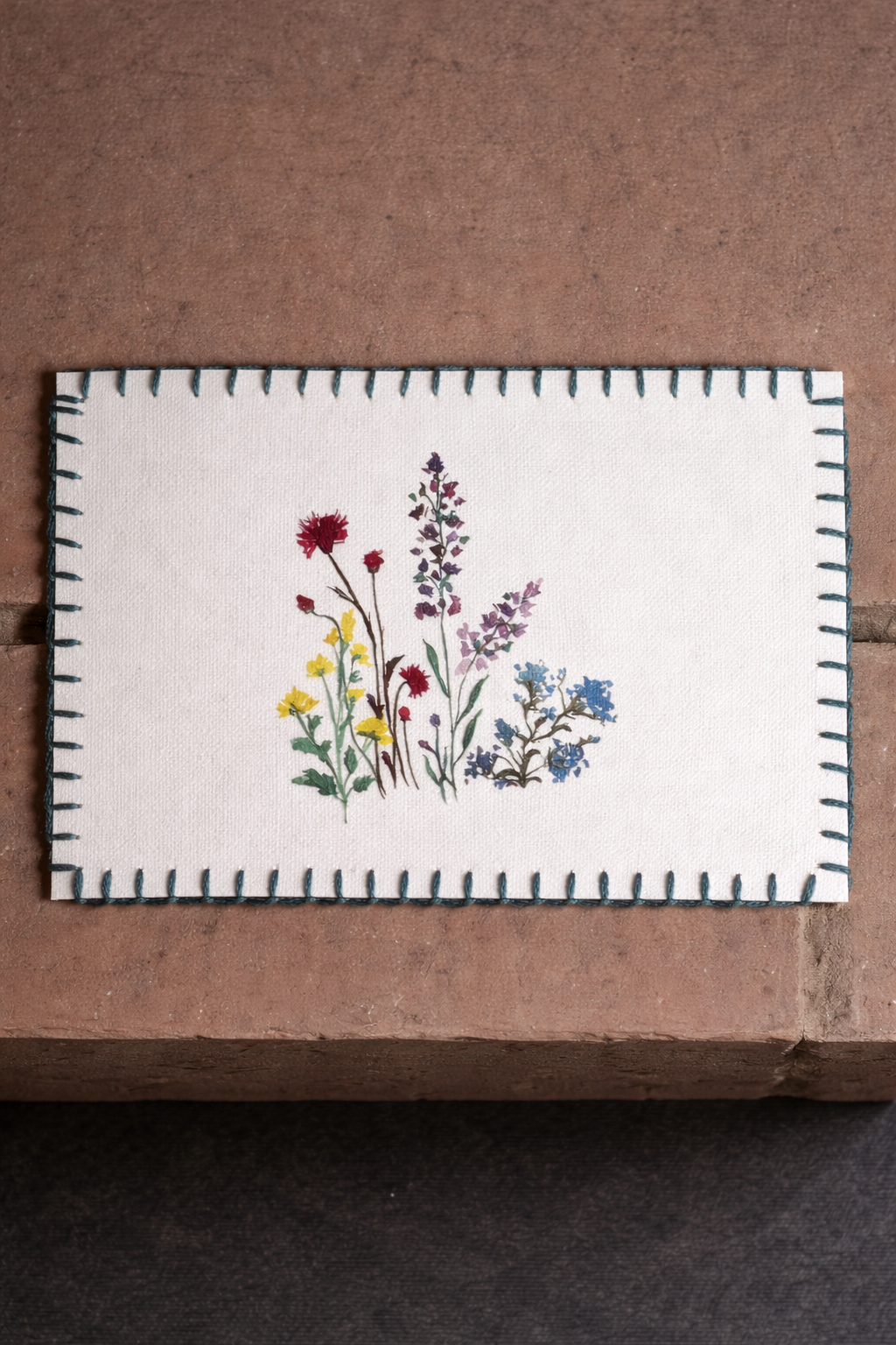 printed floral postcards displayed on a surface