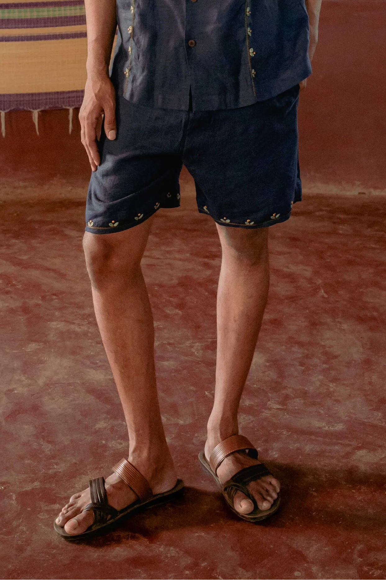 Buds in blue embroidered linen shorts