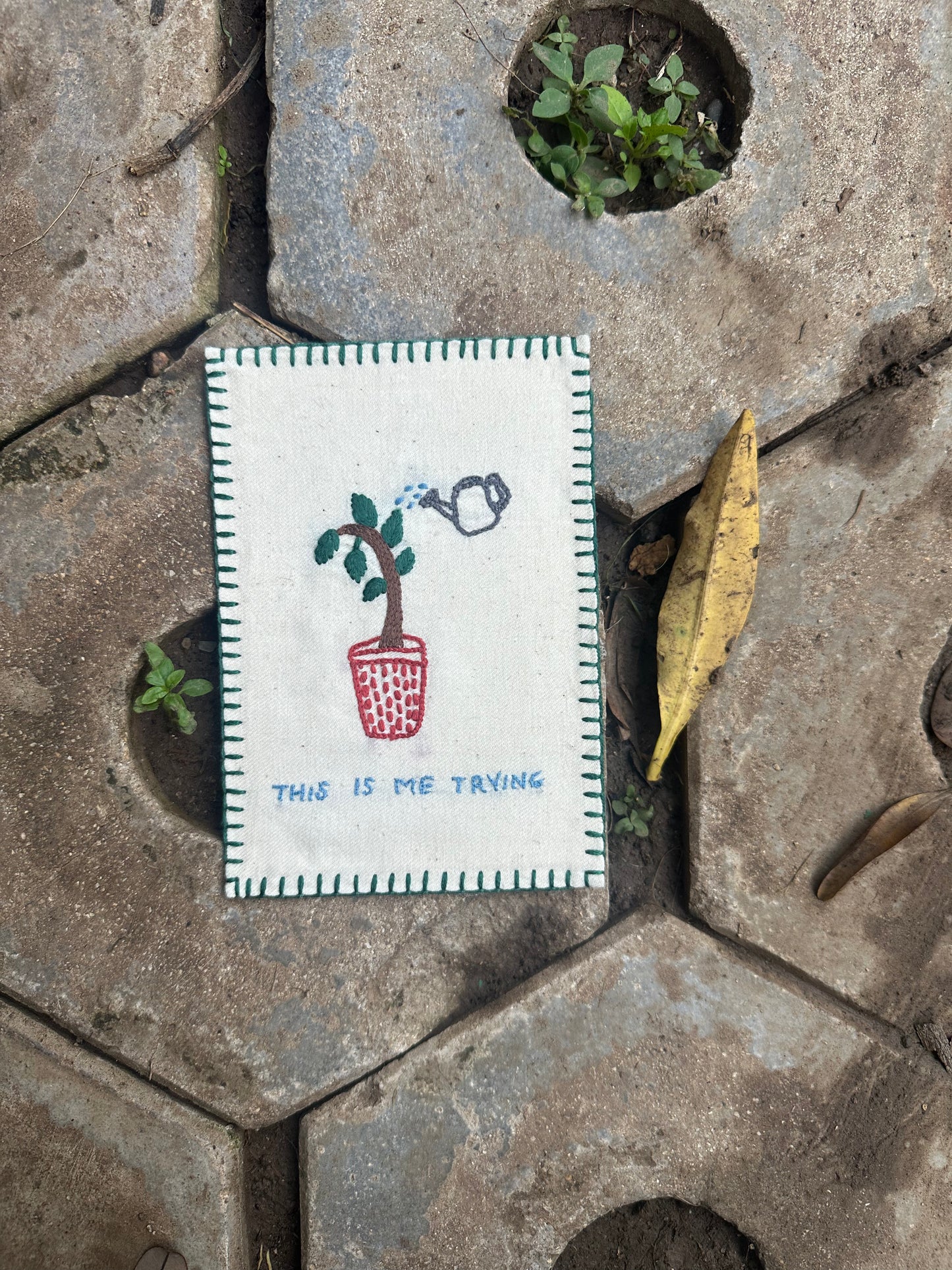 Small acts of hope hand-embroidered postcard