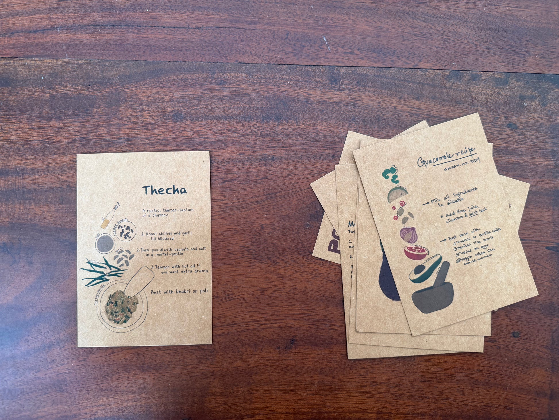 Set of recipe postcards on a wooden surface